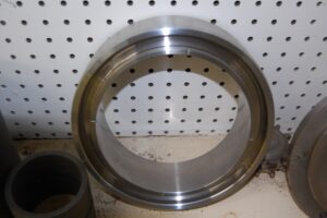 Close-up of a finished metal ring, showing machining precision at SC Industries, Houston.