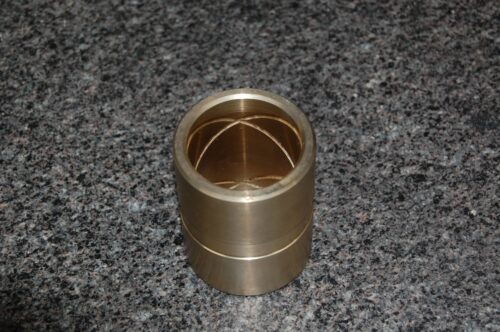 Precision-machined, cross-hatched metal cylinder, highlighting expert craftsmanship at SC Industries.