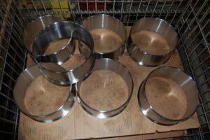 Batch of finished metal rings, ready for assembly, SC Industries, Houston.