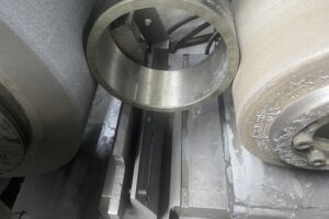 Metal ring being precision machined on a industrial equipment, part of the metal fabrication services offered by SC Industries in Houston, TX. Metal ring being precision machined on a industrial equipment, part of the metal fabrication services offered by SC Industries in Houston, TX.