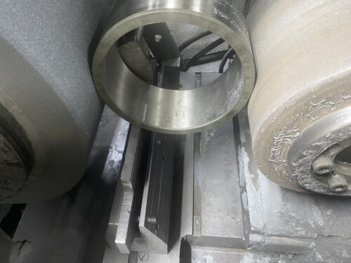 Metal ring being precision machined on a industrial equipment, part of the metal fabrication services offered by SC Industries in Houston, TX.