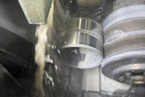 Metal cylinder machining with coolant in a manufacturing process at SC Industries, Houston. Metal cylinder machining with coolant in a manufacturing process at SC Industries, Houston.